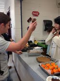 Andrew Butler, 15, buys food from the culinary club stand after school.