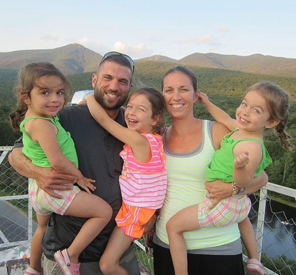 Mr.Girzone and his three daughters as well as his wife pose for a photo on a day with the family.