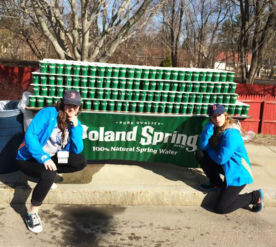 Seniors+Maddy+Snow+and+Jess+Ciarcia+handed+out+water+at+the+5th+mile+mark+of+this+years+Boston+Marathon.