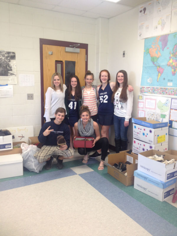 Students+from+Balfours+World+Studies+class+next+to+the+collected+shoes.+From+back+left+Bethany+Schwarm+17%2C+Jenn+Choate+17%2C+Grace+Anneser+17%2C+Maegan+Castriotta+17%2C+Nicole+Poitras+17+From+front+left+Josh+Farmer+17%2C+Kaitlin+Johnson+17