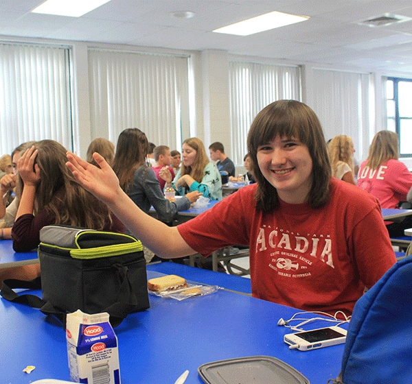 Hannah Balfour 17 eats lunch at one of the new tables in the cafeteria.