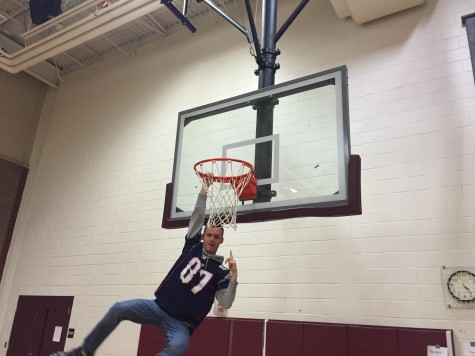 Matt Fothergill, '15 hanging from the hoop.