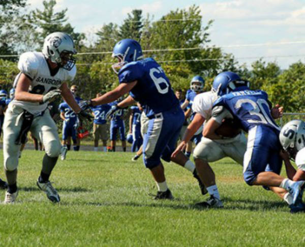 Wyatt Farwell '16 challanges a Sanborn defender in this year's September matchup at HBHS. 