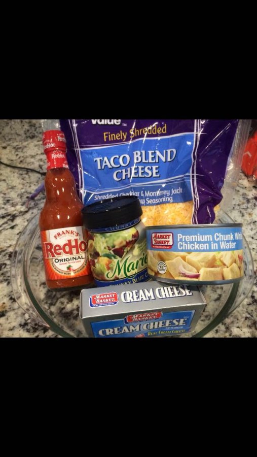 The ingredients for buffalo chicken dip, a popular snack on game day.