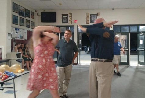 Maggie O'Hara and English teacher Michael Fox attempt Fox's original dance move, the "double dab"