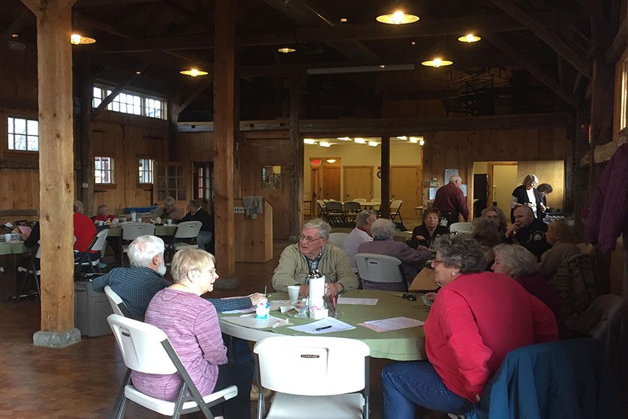 Local seniors gather to discuss important issues with the Hollis Police Department at the annual Coffee with a Cop event.