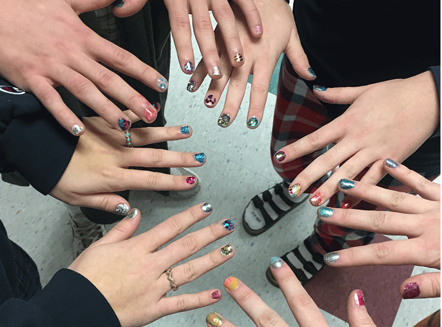 Lots of students showing off their nails. 
