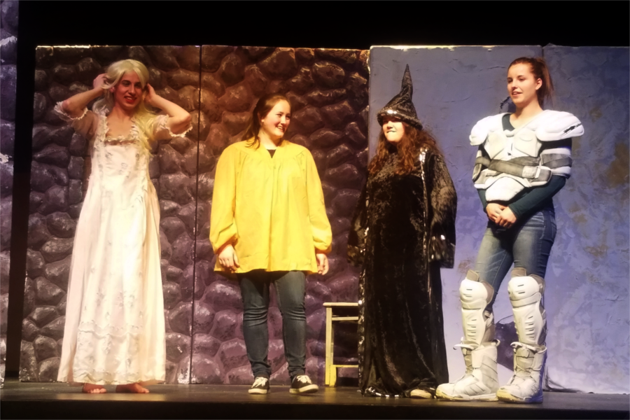Seniors Aaron Velez, Paige Gionet, Lauren Moura, and Abby Rogers appear on stage together during the final scene.