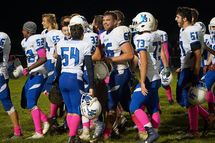 The Varsity football team celebrates after their win against ConVal last week. They beat the Cougars 21-13 on ConVal’s home field. With the beginning of playoffs fast approaching, scoreboard operator and fan Alex Basbas said that he thinks “this year might be the year” for the Cavs.