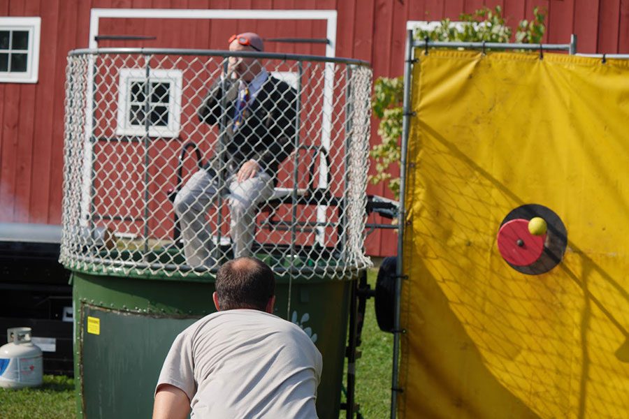Adam Wilcox dunks fellow physics teacher Eric Perry at the Senior Class Booth. Volunteers in the dunk tank included HBHS teachers, HBMS Principal Bob Thompson, and high school SRO Rick Bergeron. When asked how successful the fundraisers was, senior class advisor Tracy Gray said, “I think this was one of our best ones yet.”
