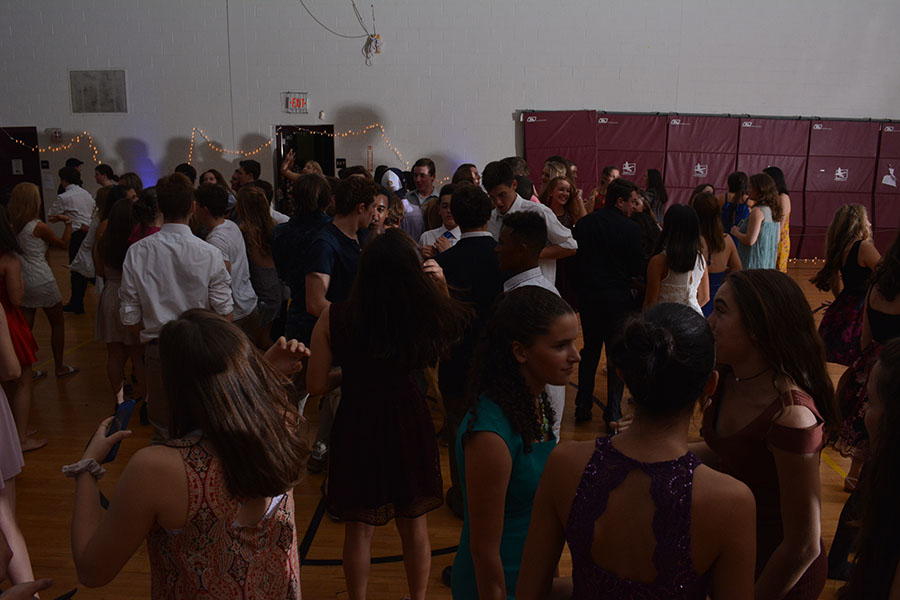 Students enjoy socializing and dancing in the mini gym. Adam McQuilkin '18, photographer and Senior student council president, said, “Homecoming was a huge success, it came out better than I could have hoped thanks to the wonderful Mr. Perry and Ms. Ainsworth-Brown, our class advisers, and the HB student body.”