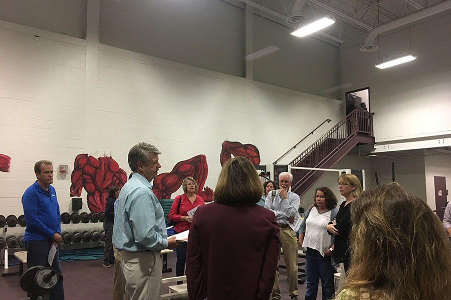 Tom Whalen describes the changes being made to the high school. Community members participated by asking questions about logistics, costs, and intentions.
