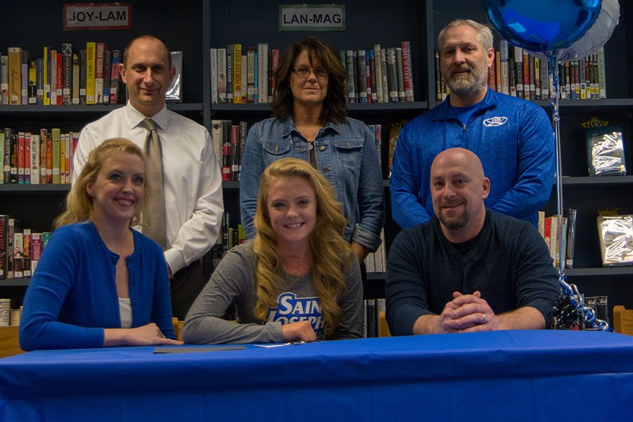 Meghan Hill ‘18 and her parents sit front row with (left to right) Principal Richard Barnes, Coach Tracie Thorp, and Athletic Director Ron Rupp in back. Hill signed to play field hockey with St. Joseph’s of Maine on Thursday.