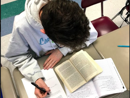 Teagan Hudzik ‘19 studies a detailed text in Mrs.Illingworth’s AP Language and Composition class. All of the “AP Lang” students are preparing for their exams in May. “I take 5 [AP Classes]. I just feel like it is good to challenge myself… I really like learning,” said another AP Language and Composition student, Dhruv Miglani ‘19.