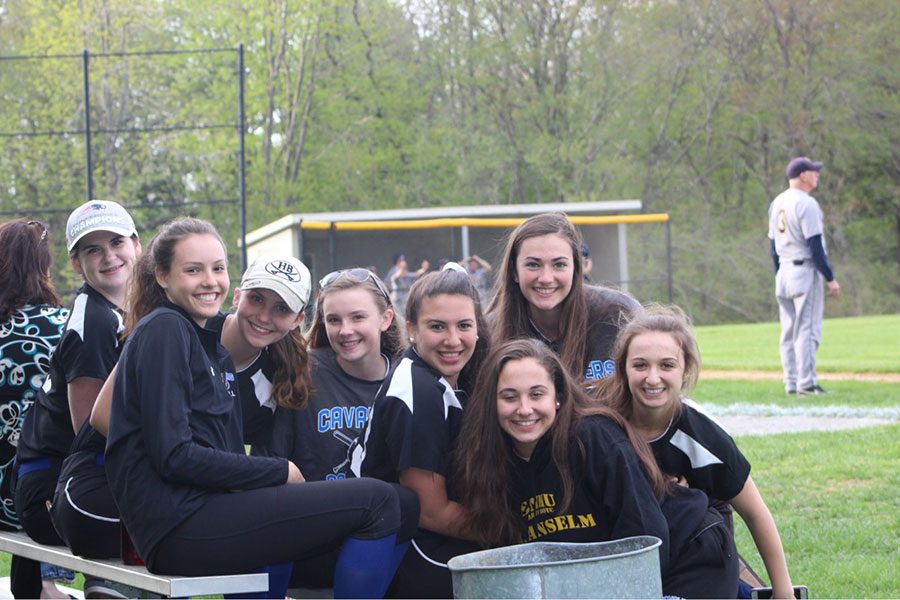 The softball players all gather together in a silly picture during a game. “It has come down to one or two innings [each game] where we can’t get out of the hole; other than those times- we play very solid” said Gray.  
