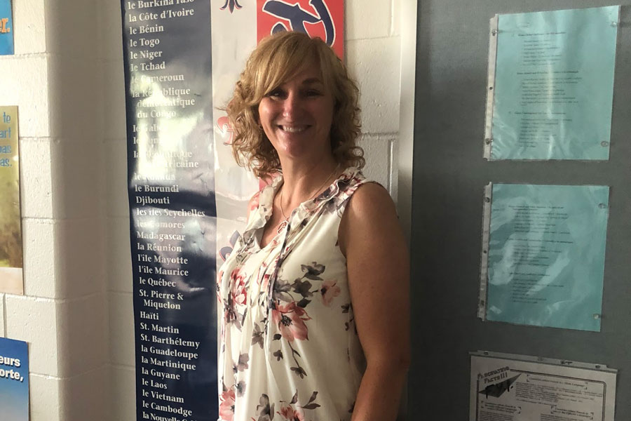 Faucher smiles as she stands in her classroom, wearing a spring blouse and maroon pants (not pictured). Whenever White House Black Market gets a new shipment of clothes, they call Faucher and prepare a room of styles she might like. “I am a matching freak. I know for sure what I don’t like,” she said. “I’m my own style.”