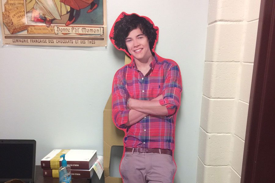 A cardboard cutout of Harry Styles reclines in the corner of Jennifer Given’s room, after a long year of having been used as a prop in countless history projects.