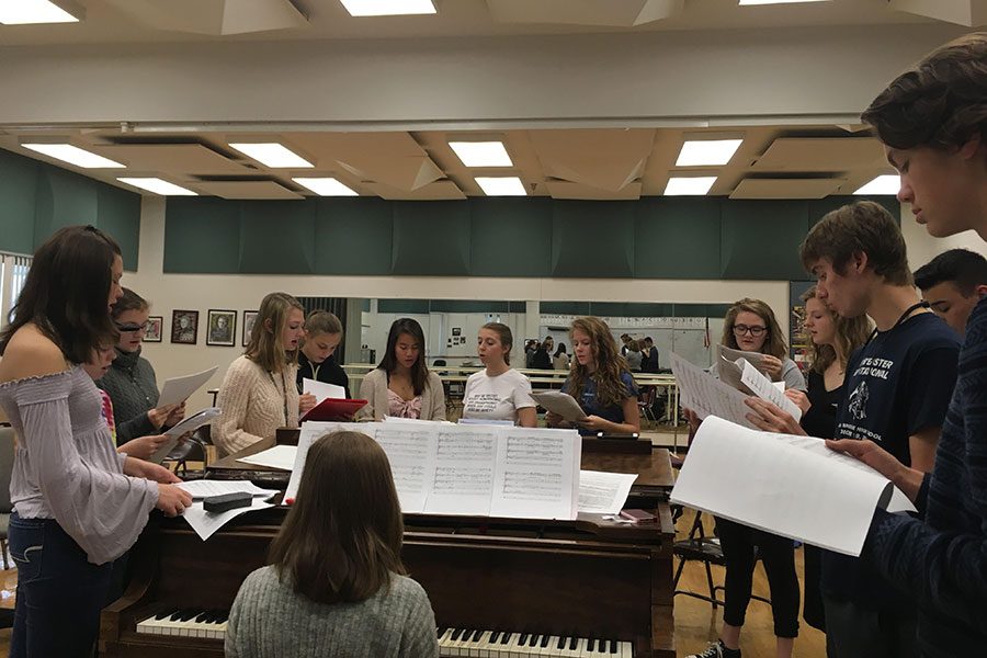 Fermata Nowhere members sing Dancing On My Own, by Calum Scott, arr. Robin, at their first rehearsal with the addition of newly auditioned members on September 21. Pictured from left to right is Nicole Plummer ‘19, Megan Mitchell ‘20, Emily Fox ‘22, Laurie Houvener ‘19, Katie Marsano ‘22, Lia Eisenberg ‘21, Erin Moynihan ‘19, Rachel Delong ‘22, Sam Price ‘20, Caroline Pack ‘19, Evan LaFrance ‘20, Daniel Delong ‘19 and William Scales ‘22, with Anna Musteata ‘22 as the rehearsal pianist. “I felt like we sounded really good and it’s nice to be with a group of people who know what they’re doing and they’re all really really good singers,” said Emily Fox ‘22.
