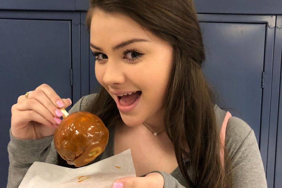 Kylie Whiting ‘19 enjoys a sweet caramel apple during Thursday’s CAV block. Shes one of many students who has enjoyed the new monthly treat sold by Life Skills Program. “Caramel apples are the best. Sticky candy and a crisp apple, you cant go wrong with that!’ said Whiting.