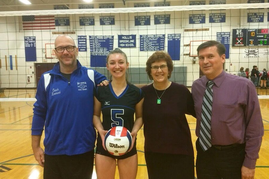 Kyra Belden stands with her head coach, Rebecca Balfour, on the right, and assistant coach, Jake Balfour, on the left after her game on September 28. Kyra secured her 1000th career assist as a senior at HB. “Thank you to my whole team for pushing me in practices and ingames to reach this goal,” said Belden.  