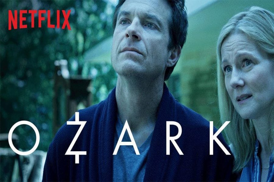 The official thumbnail for the Ozark series, featuring Marty Bryde and his wife Wendy, played by Jason Bateman and Laura Linney. The two are in front of their new home in the Ozark, Missouri.