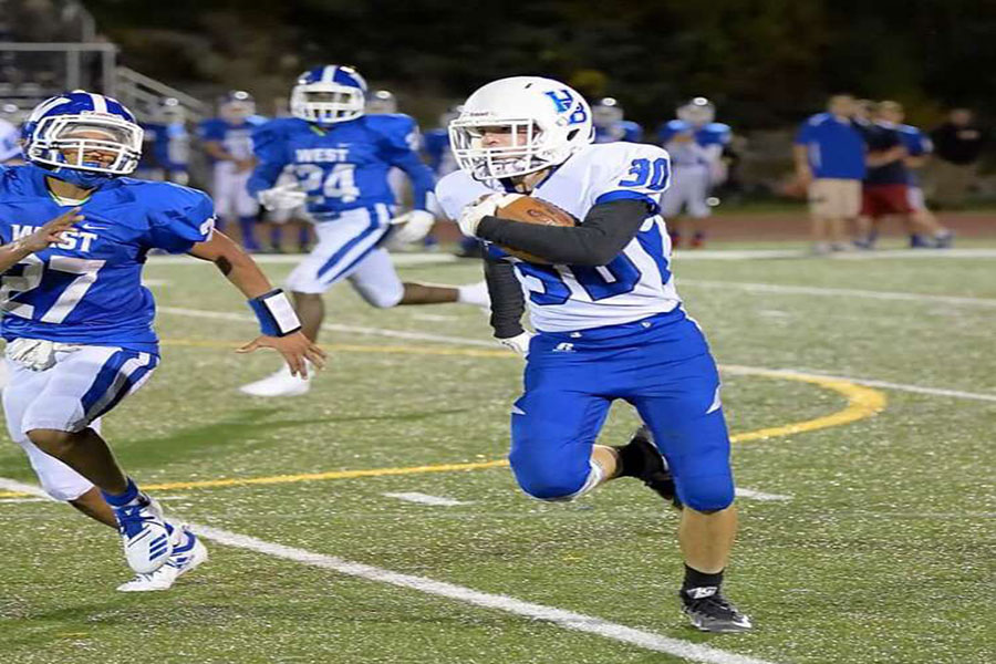 Michael Gillespie is running the ball. He is in his offensive position, running back, versus Manchester West on 9/21 . He’s “always in position” according to Hillard, which is why he has so many receptions.