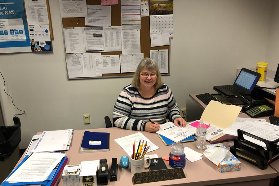 Mrs. Risdal sits at her desk as she works on college apps. This department can help with all issues including social, emotional, and academic. “This school counseling department is very dedicated to helping kids navigate through high school,” said Theressa Risdal.