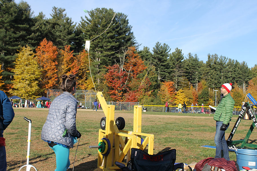 Ashley Mayo, part of Lawner’s “Carebear” treb group, launching their trebuchet. Dressing up gives students a chance to line up a teacher and hit them with a balloon, which is partly why the testing of the trebuchets lines up with the HBHS Halloween Assembly. It’s a “whole day of fun” according to Kramarczyk, who enjoys seeing his friends dress up.
