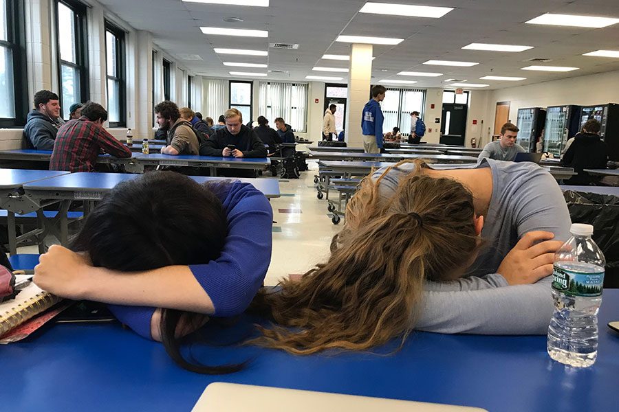 Seniors Mia Fokas ‘19 and Mia Pickard ‘19 take a nap during Cav Block. For seniors, Cav Block is the perfect time to relax, eat, or finish a procrastinated assignment. “If you wait last minute [to finish homework], Cav Block is amazing,” Pickard states. 
