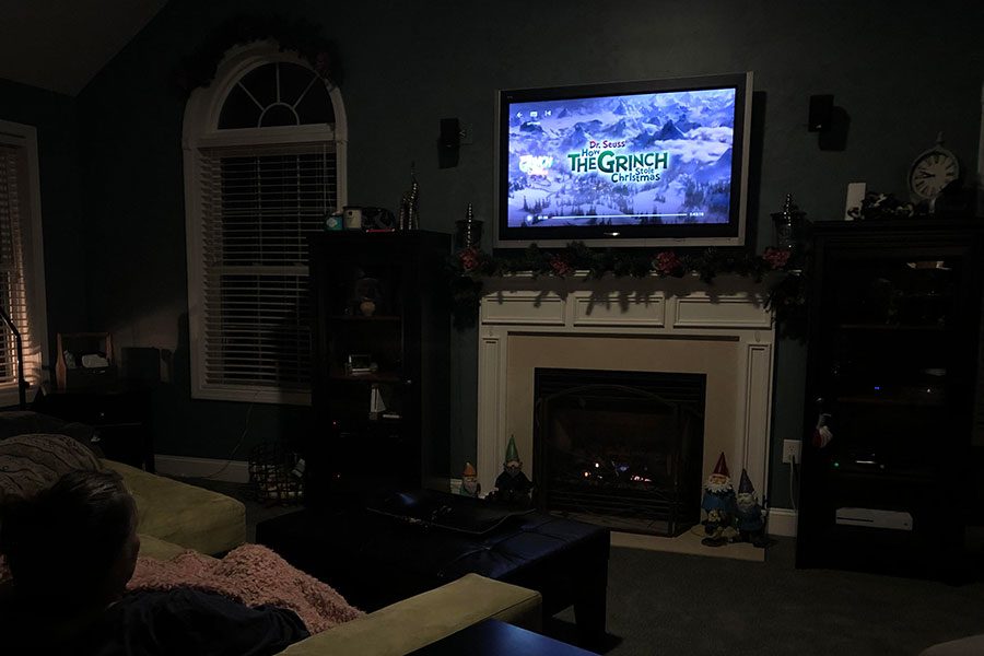 A holiday movie enthusiast watches How the Grinch Stole Christmas. Released in 2000, this movie is the second of three movies based on Dr. Seuss’s How the Grinch Stole Christmas. “Its just a really touching story, and it has a great soundtrack,” said Ashlyn Mansfield ‘19. 