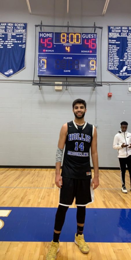 Dhruv Miglani ‘19 stands proudly in front of the score board at the end of his career boosting game. Miglani has a fantastic game with 19 points on the night. “I don’t think I’m ever going to forget hitting that shot,” said Miglani. 