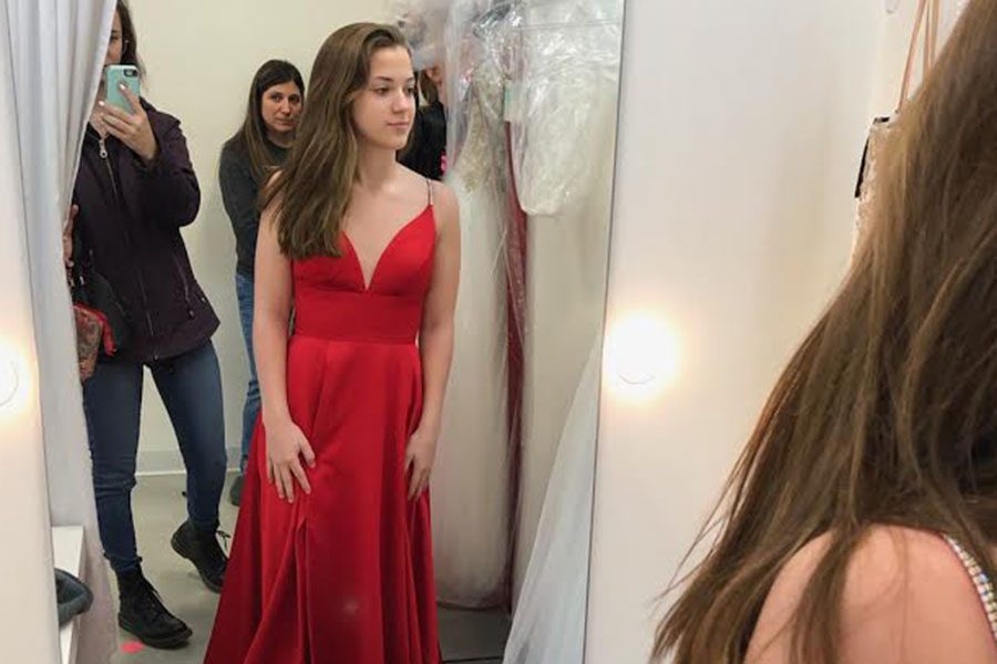 Peyton O’Connor ‘20 is trying on prom dresses in early February. Going to prom as a junior, she says, “it should be a fun experience and make planning for next year easier.” 
