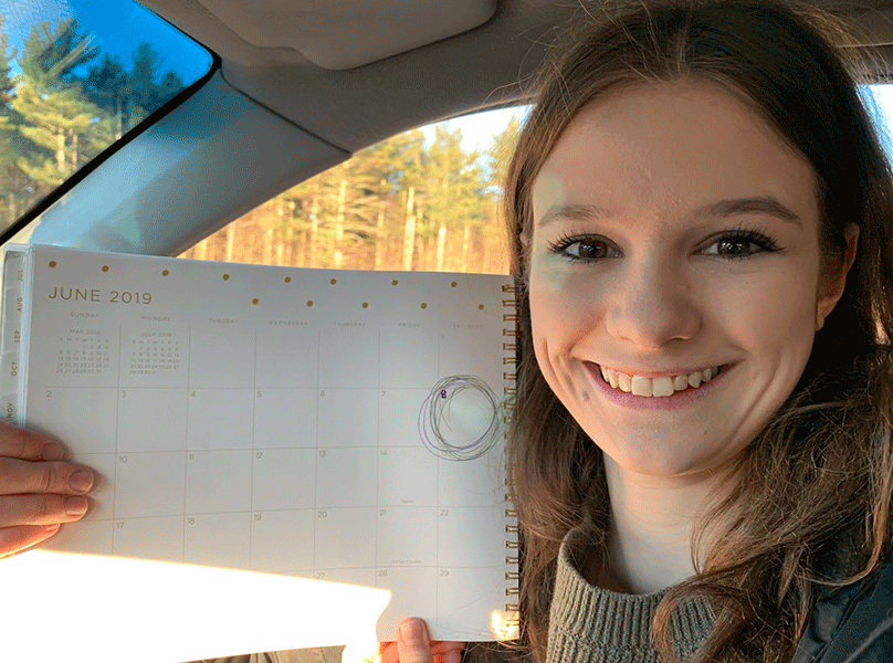 Ashley Mayo ‘19 sits with her calendar showing the school’s proposed graduation date. She can’t wait to “go onto bigger things,” after high school, and plans to go to college in the fall. 