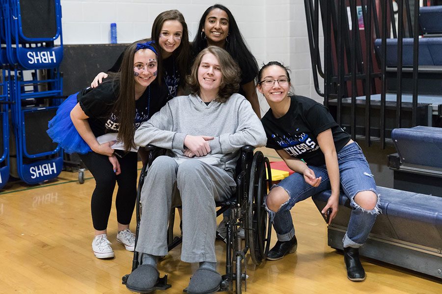 Niko Martin is photographed with (from left to right) Sofia Barassi19, Gabby Paquin19, Khishi Patel19 and Tess Crooks19 during their Spirit Week assembly in February
