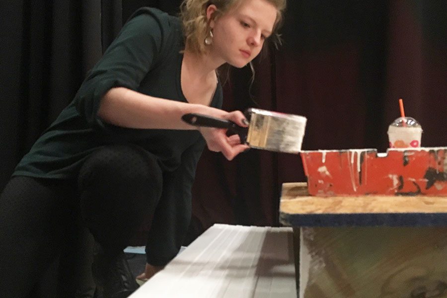 Stage manager Caroline Pack ‘19 paints steps for the set of Mamma Mia.