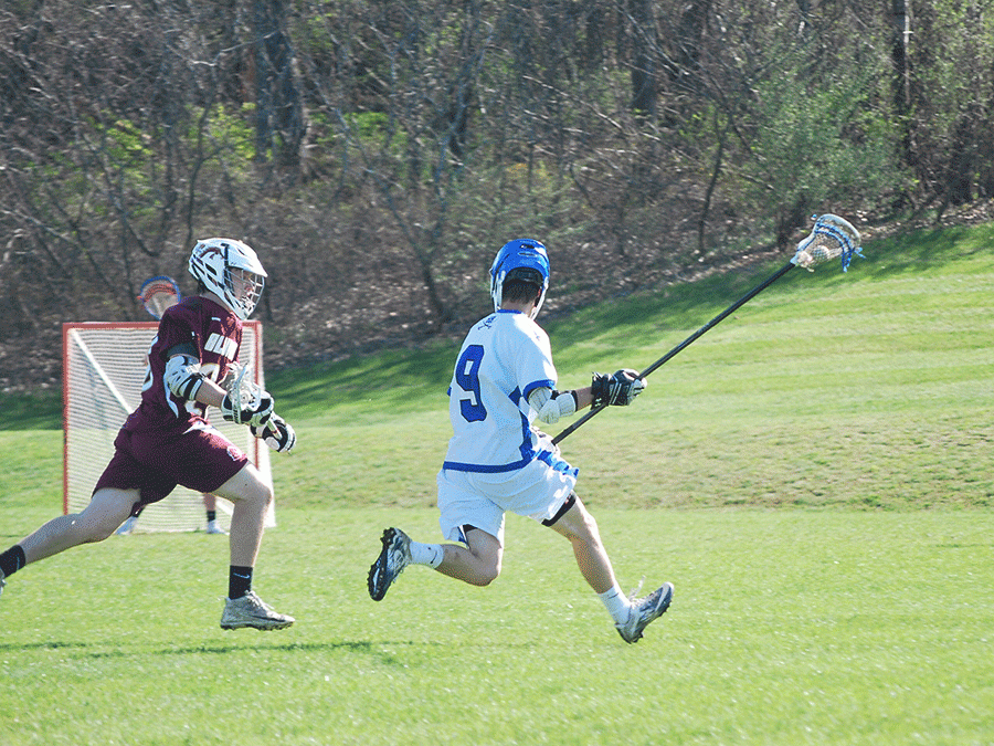 Connor Farwell ‘19 plays against Alverin on their season opener on April 10th. While Farwell is a small player he has been a three year varsity player despite is short stature. “You can learn skills to evade players” says Farwell, which he demonstrates as he goes around an Alverin player. 