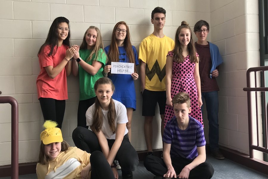 Left to right: Freshmen Lara Coady ‘22, Hallie Bardani ‘22, Maggie Crooks ‘22, Miles Montgomery ‘22, Emma Harley ‘22, Jeremy King ‘22, Noah Sinclair ‘22, Claudia Pack ‘22, and Anna Musteada ‘22 having fun during Spirit Week. Note the smiles on their faces. These are sure to vanish by the time they become upperclassmen.