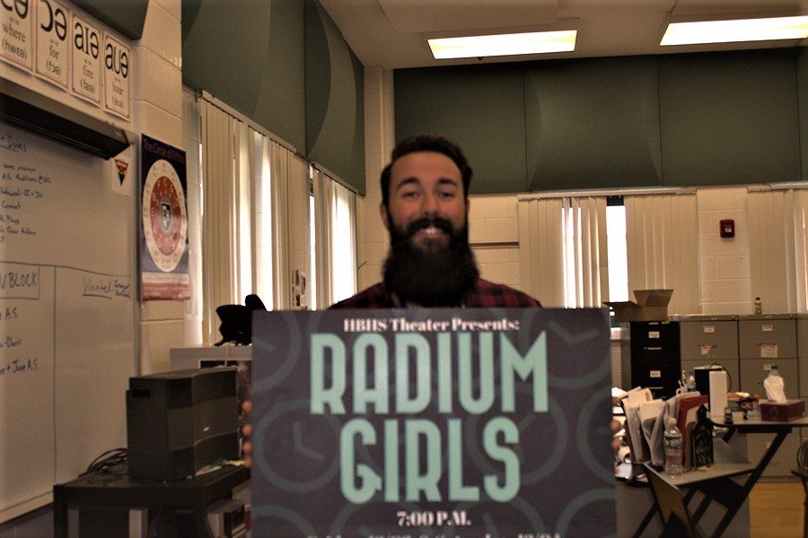 Matthew Barbosa holding the poster for Radium Girls, opening and closing night December 6 and 7 and 7:00 pm. Based off of a true story of women who worked in a factory painting watch dials to glow in the dark. “It’s a cool play,” Barbosa said.
