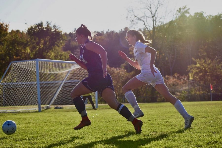 Tasha White ‘20 during a 2018 regular season game against Souhegan, chasing the ball as she approaches goal. This is the third season she has been a starter for the Hollis Brookline Varsity girls soccer team. “We have the full potential everywhere on the field to make playoffs, even if someone is not there,” said White.

