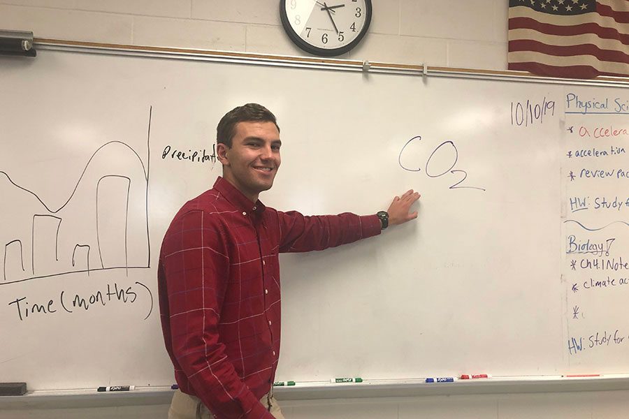 A new addition to the science teaching staff, Nicholas Houseman, points to the board after teaching a lesson on carbon dioxide. ”He is very engaging and he is clearly very passionate about Biology,” said Aliya Lewis ‘22.

