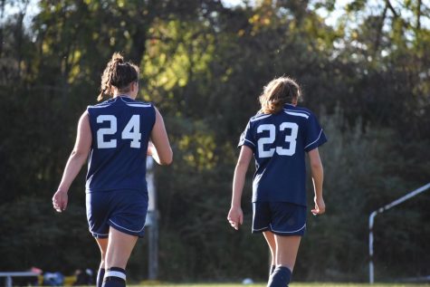 Tasha White and Rachel Brackett heading time the bench after a 2018 game against Souhegan. This is White’s fourth year on Varsity as a senior and Brackett’s second as a sophomore.
“We have girls that can play any position and well and that’s not common, it’s great to have a solid team on the field and even on the bench because you never know what will happen,” said White.