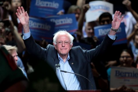 Vermont Senator Bernie Sanders raises his arms in victory following the New Hampshire Primaries. Sanders edged out his top opponent Pete Buttigieg, accruing 26% of the Democratic vote. According to WMUR, Sanders addressed supporters following his victory.