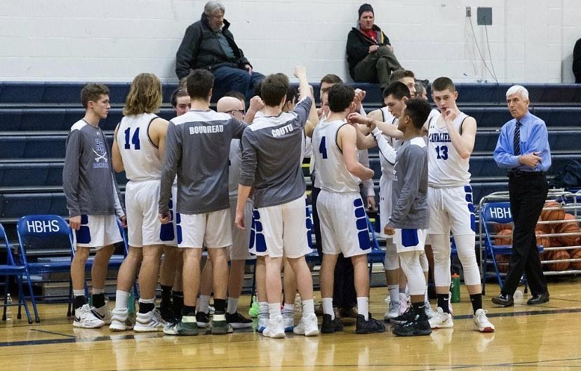Players gather in a huddle during a timeout in last winter’s game vs. Hanover. HB went on to win this game to set them up well for the playoffs. 