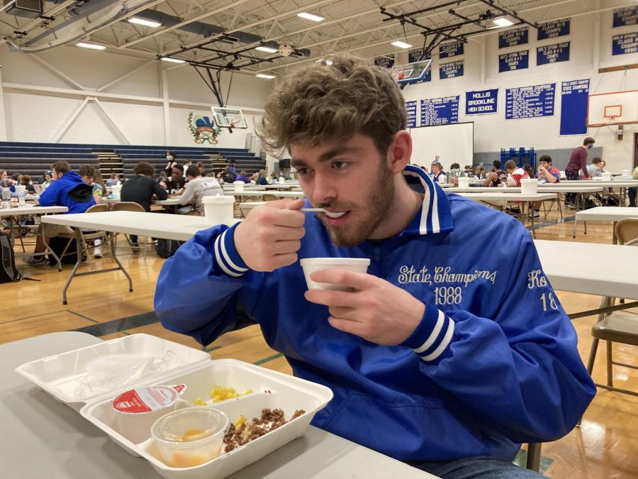 Jackson Koopman ‘21 tries a meal apart of the free meal program.
“The school lunch program has good meal options, but I feel as if it is portioned too small for high school students.”
