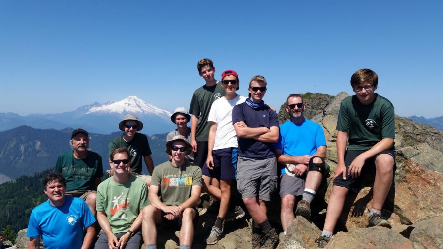 Hollis Brookline High School senior, Jack Robinson, (third from right) poses with a few members and advisors from Troop 12 on the top of Mt. Sauk in Washington state. “My favorite part of scouts was being presented with the ability to experience so much in the outdoors and I also received some invaluable experience in leadership,” said Robinson.