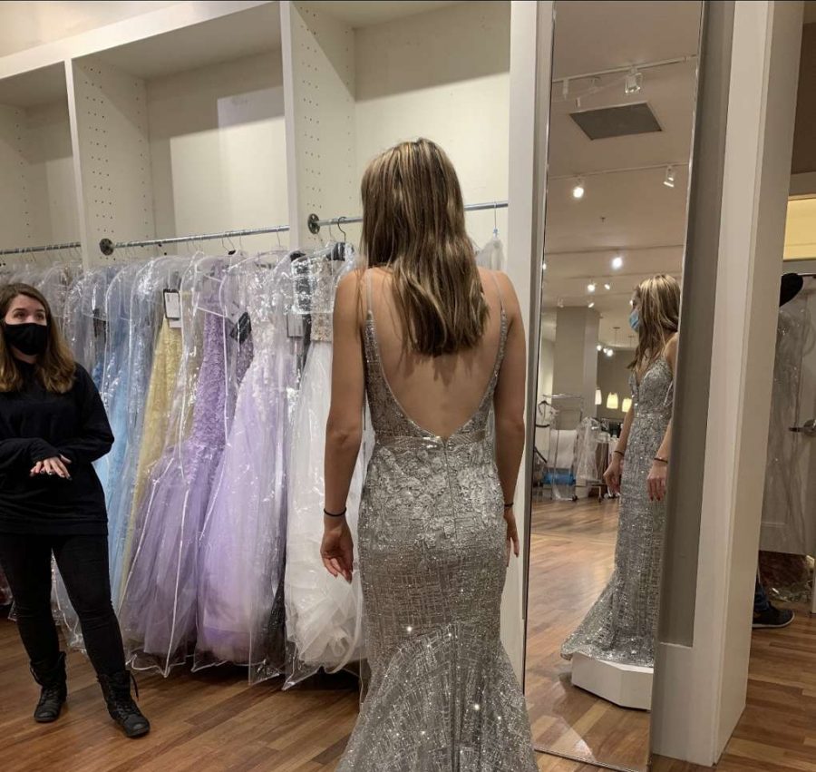 Brooke+Allanach+21+is+seen+shopping+for+a+prom+dress%2C+which+is+a+huge+deal+to+get+the+dress+that+fits+the+best.+The+idea+of+going+to+prom+sounds+wicked+fun%2C+taking+pictures%2C+limos%2C+dancing%2C+having+dinner+and+being+with+my+friends+and+classmates%2C+said+Allanach.