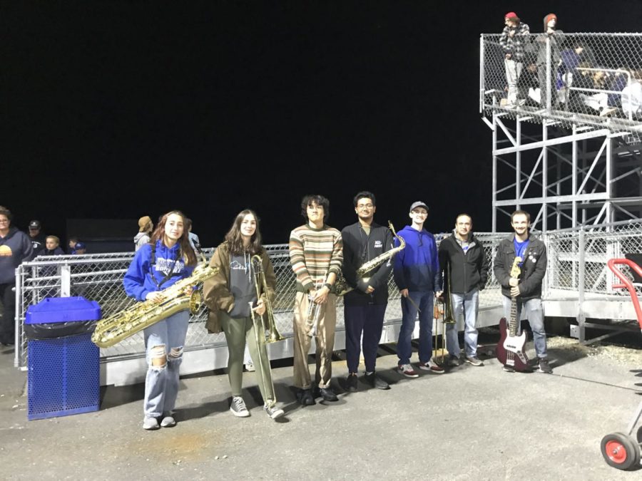 Pep band members pose for a picture after a successful football game performance on September 30, this year marking the first time that pep band has played at the new football field.”