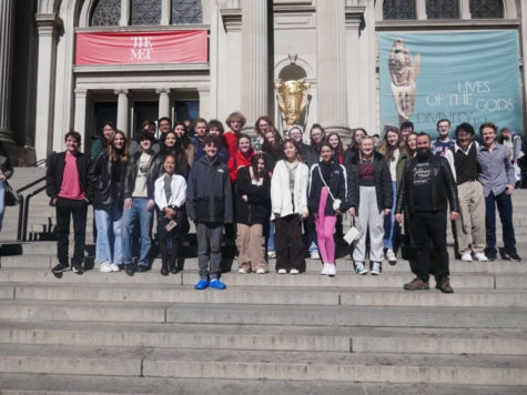 Band and choir students stand in front of the MET.