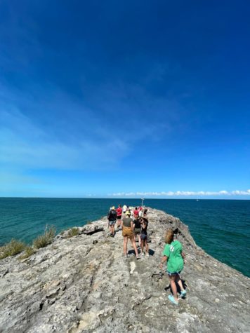 Students from Parker Charter School explore the tip of Morgans Bluff, the highest point of the island, on their school trip to Andros Island, Bahamas. 