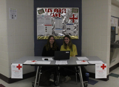 Red Cross Club Members Addie Marchant and Jess Follensbee encouraging classmates to sign up for the Blood Drive during lunches.

